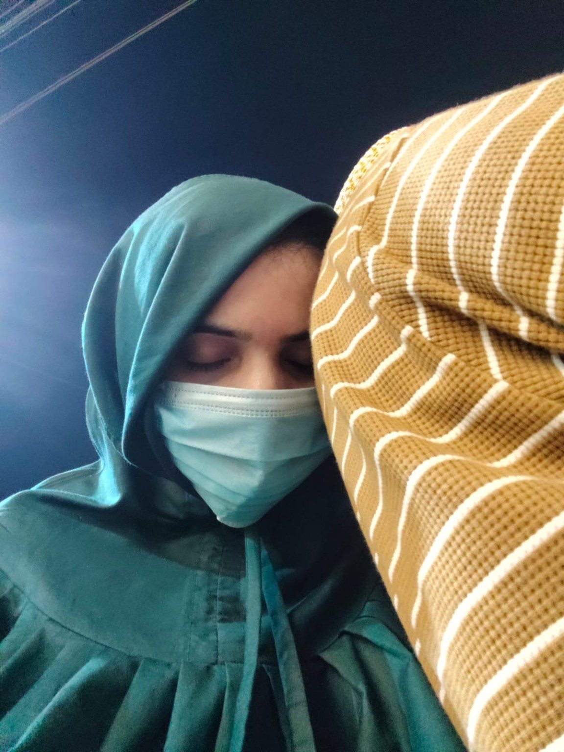 Mariya resting peacefully on Burhanuddin's shoulder
