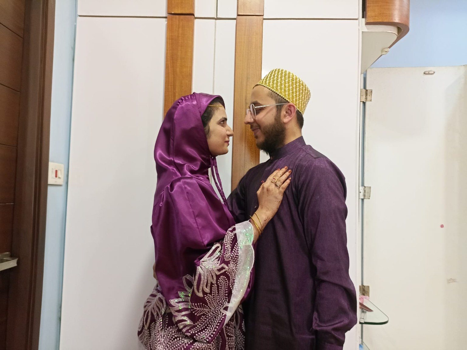 Mariya and Burhanuddin looking at each other