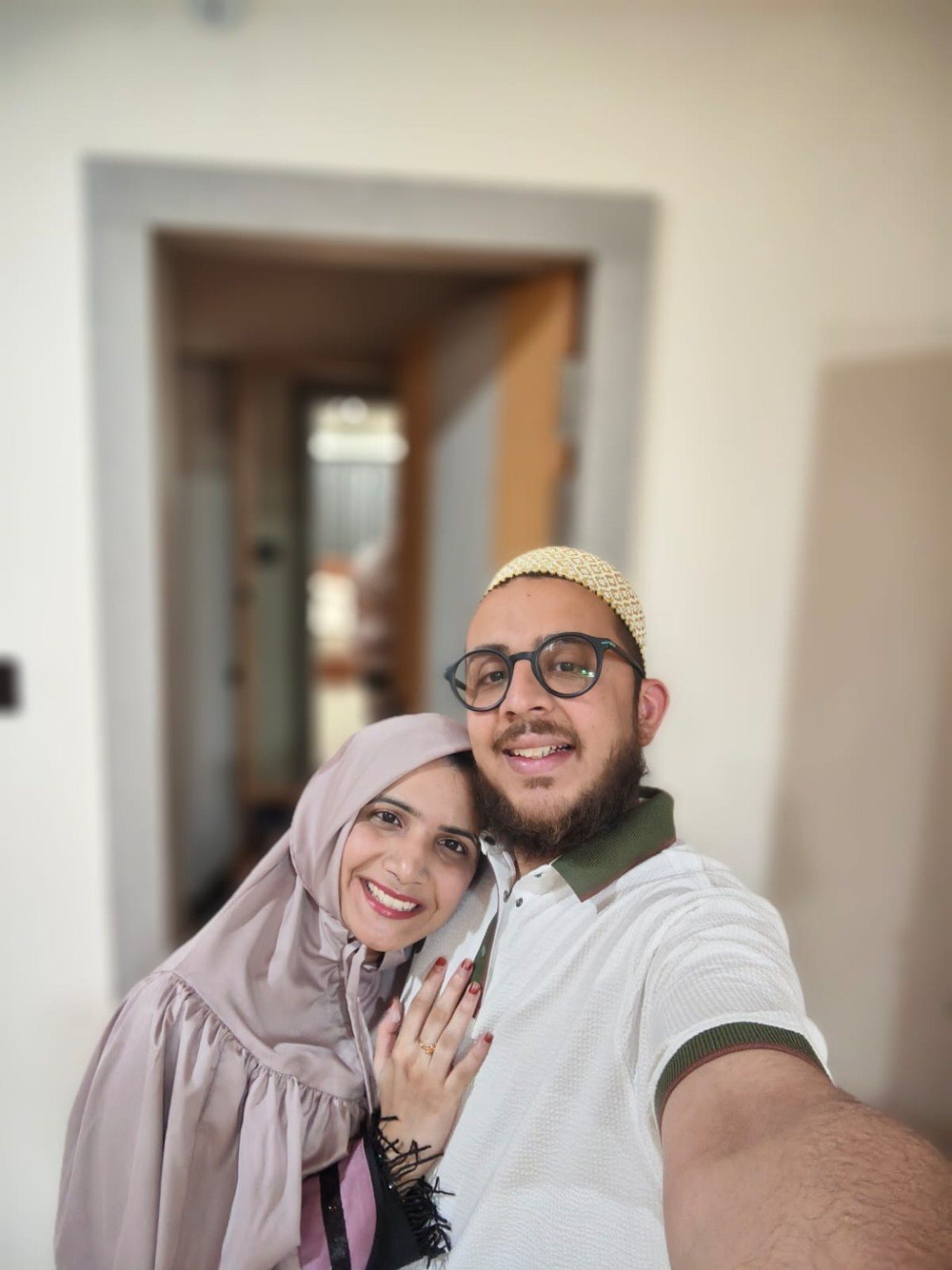 Mariya and Burhanuddin taking a bedroom selfie before dinner