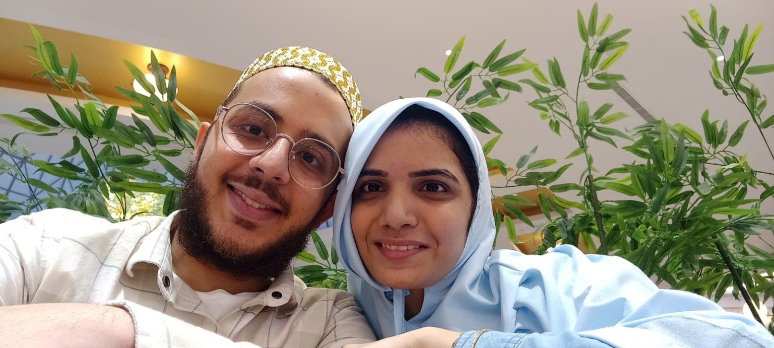 Mariya and Burhanuddin taking a selfie in a mall